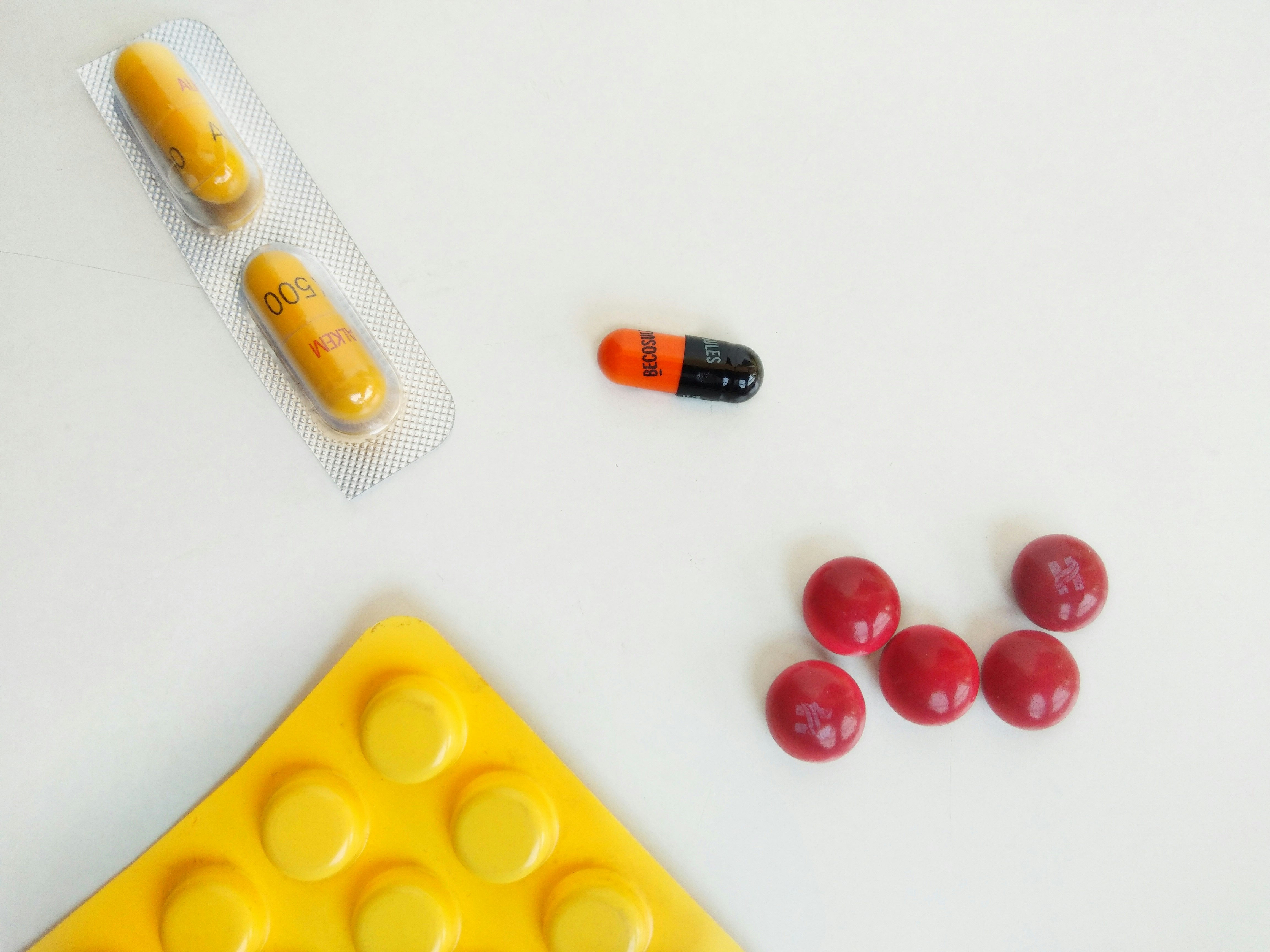red and yellow medication pill blister pack